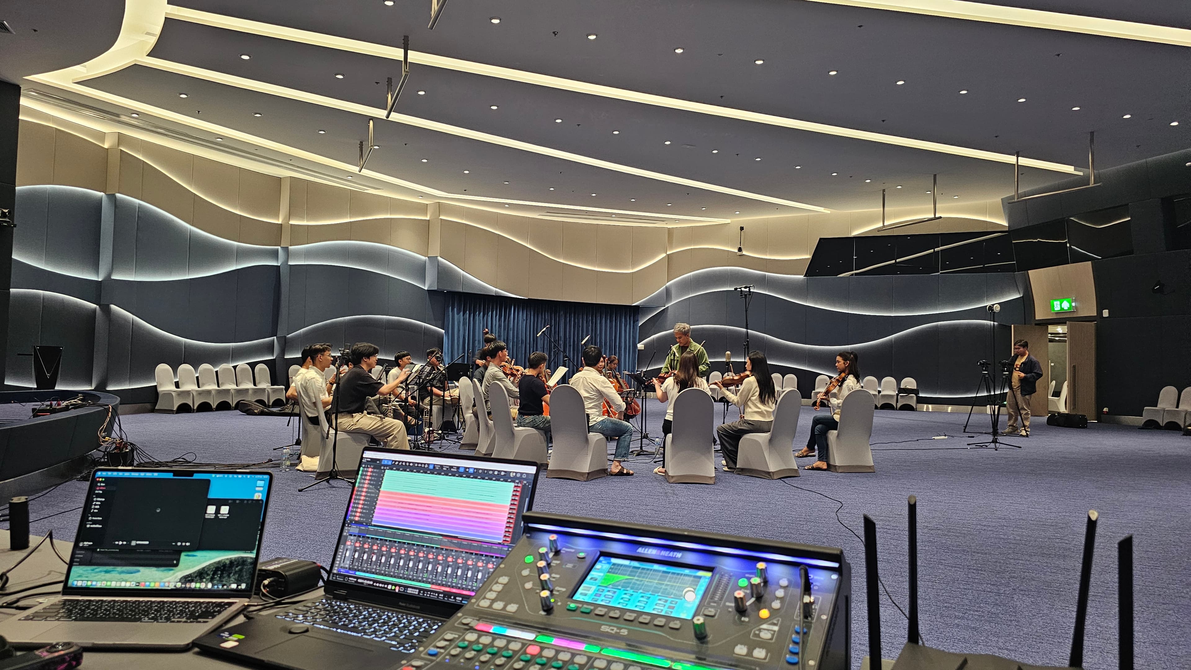 Architectural detail inside The Great Hall showing the illuminated acoustic wall treatment.